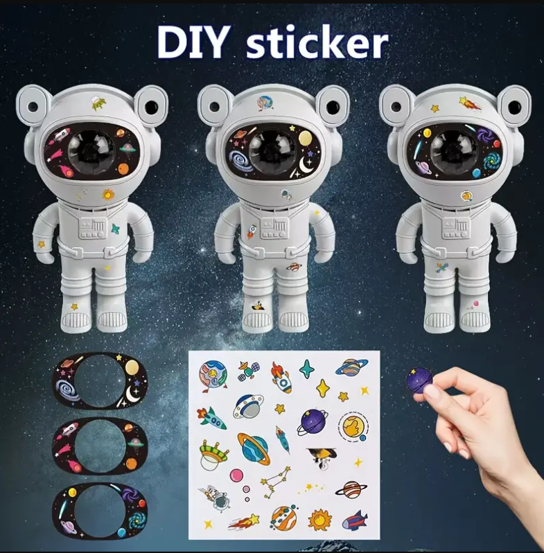 Proiector LED in forma de astronaut cu sunete si lumini, stickere autoadezive, conexiune Bluetooth