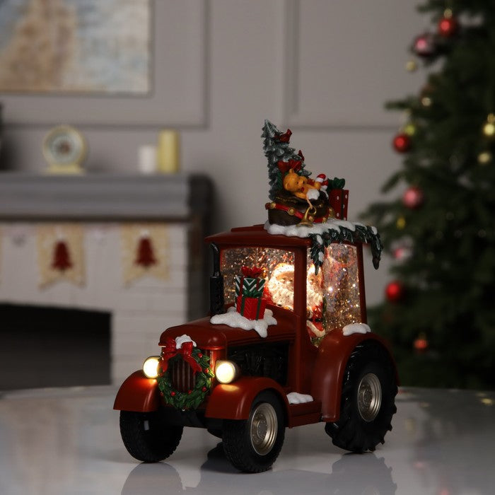 Decoratiune Craciun tip Tractor cu Mos Craciun, brad si cadouri, functie muzicala, zapada in miscare, 25 × 13 × 21 cm
